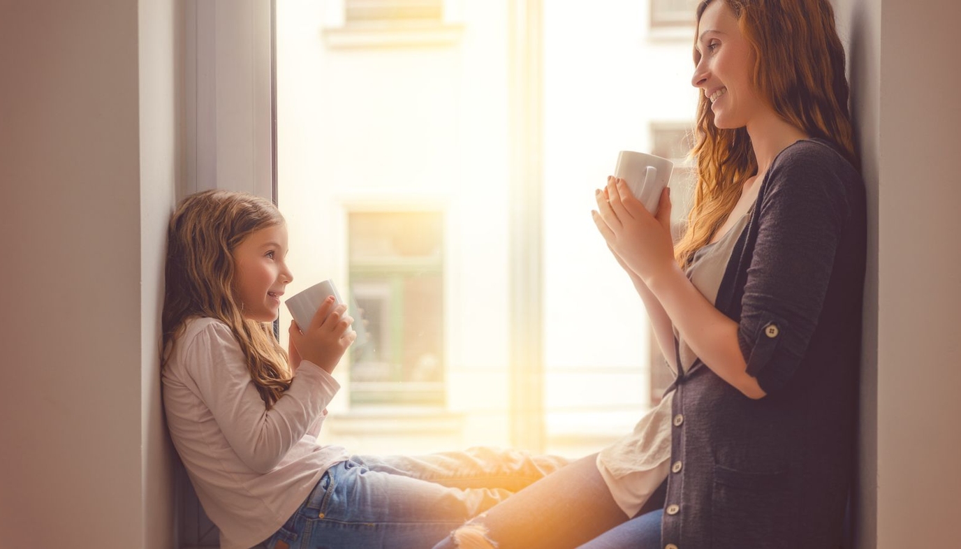 mom and daughter drinking coffee