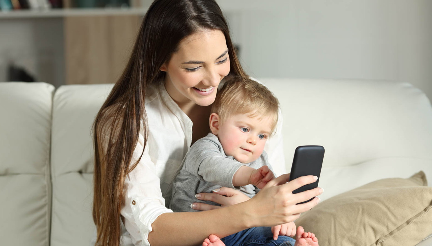 woman on tablet apps every new mom needs
