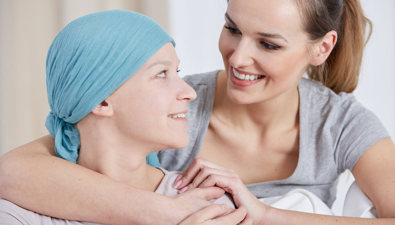 woman comforting friend with cancer