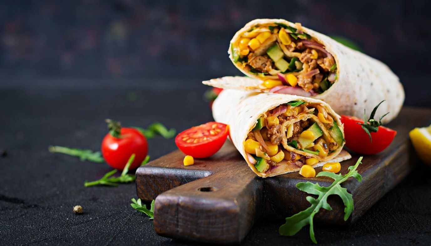 burritos on a cutting board