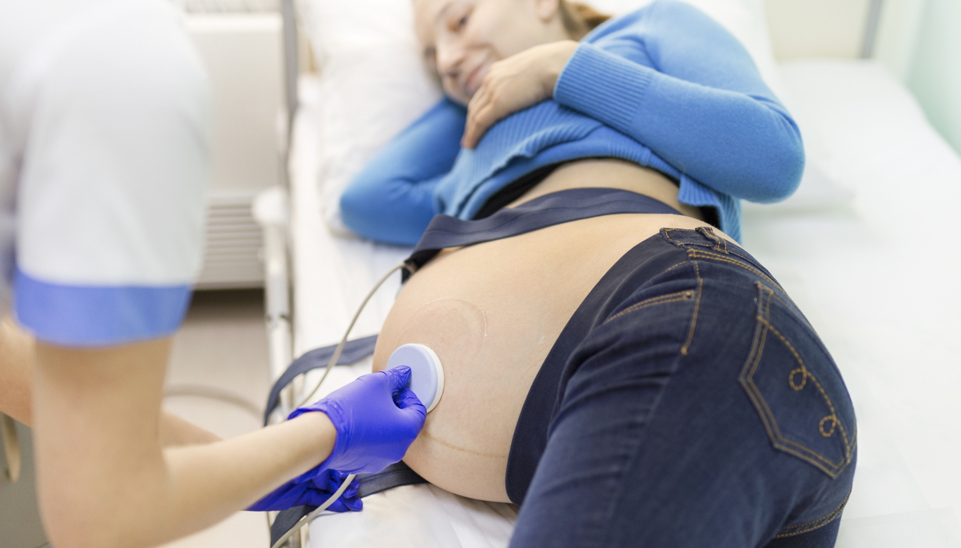 pregnant woman being monitored at the hospital