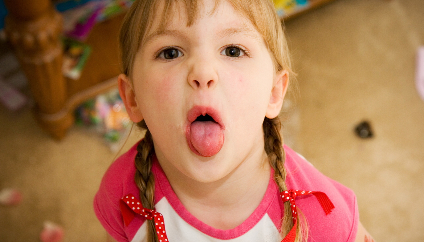 toddler sticking her tongue out