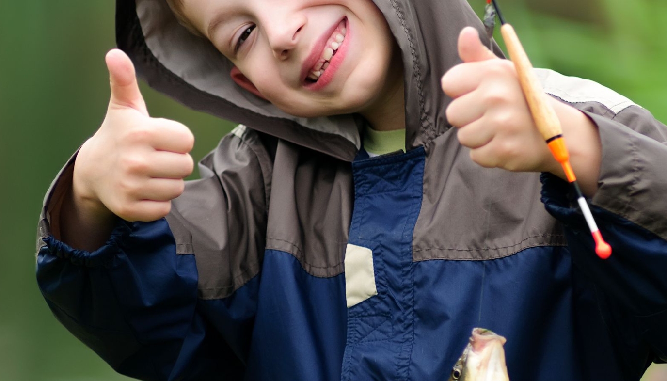 cute boy with thumbs up