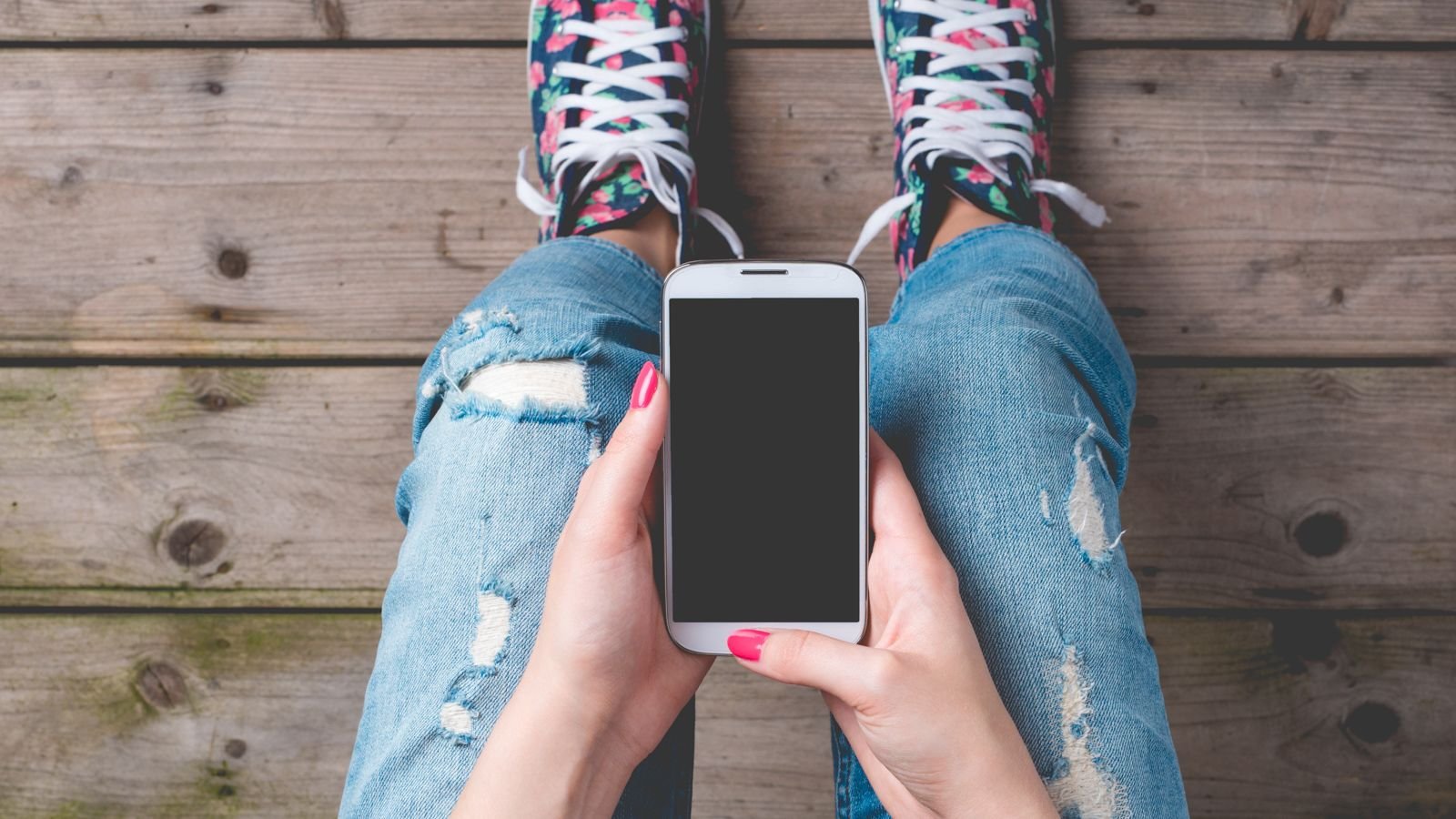 teen holding cellphone