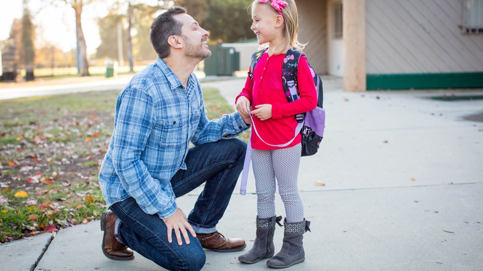 father talking to child before school