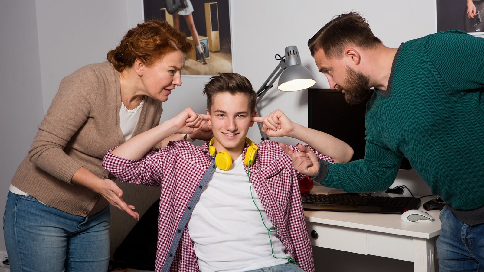 teen boy ignoring his parents