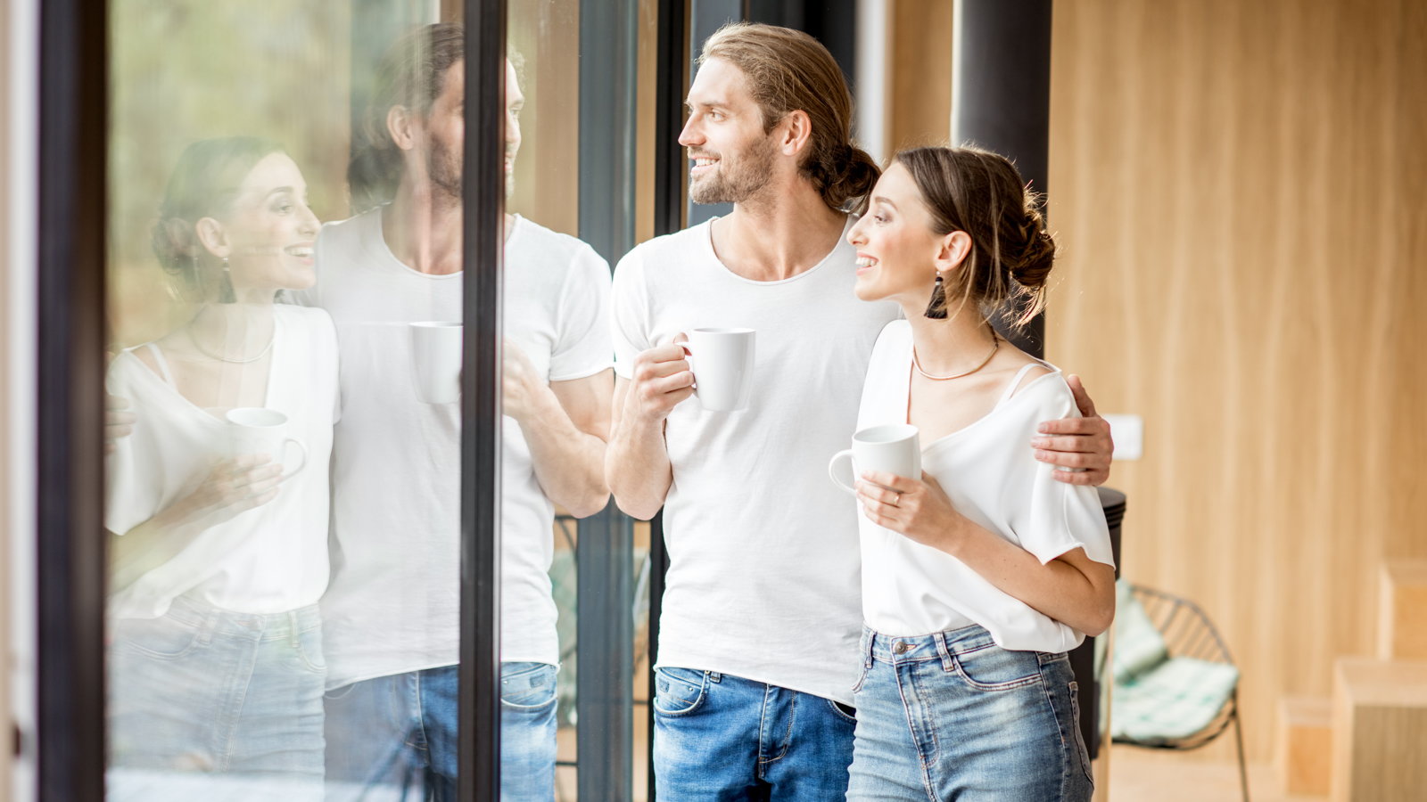 couple looking out sliding glass door