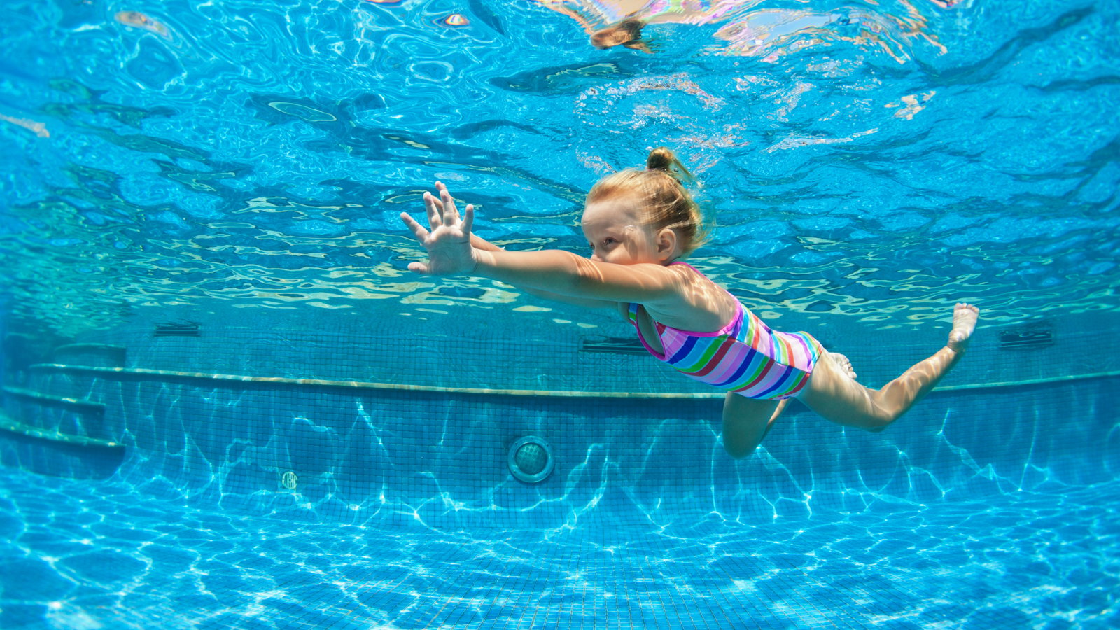 girl swimming in the pool