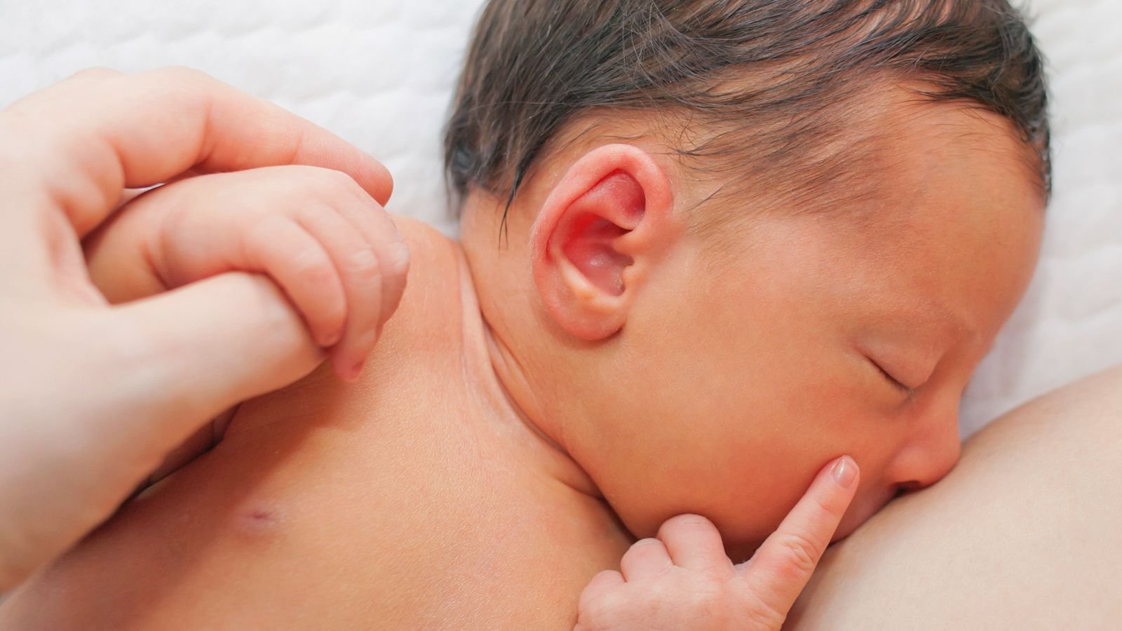 mother breastfeeding infant