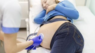 pregnant woman being monitored at the hospital