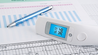 thermometer with fertility chart