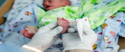 An infant receiving the heel stick test.