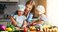 mom cooking dinner with children