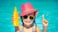 girl in the pool holding bottle of sunscreen