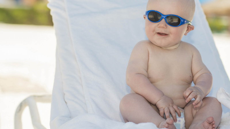 Baby smiling with sunglasses