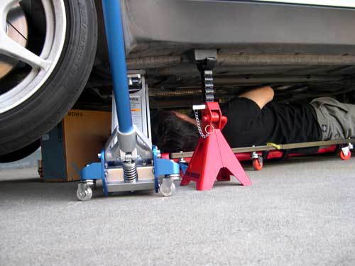 Even when on jack stands, a floor jack under the car gives you an extra measure of safety