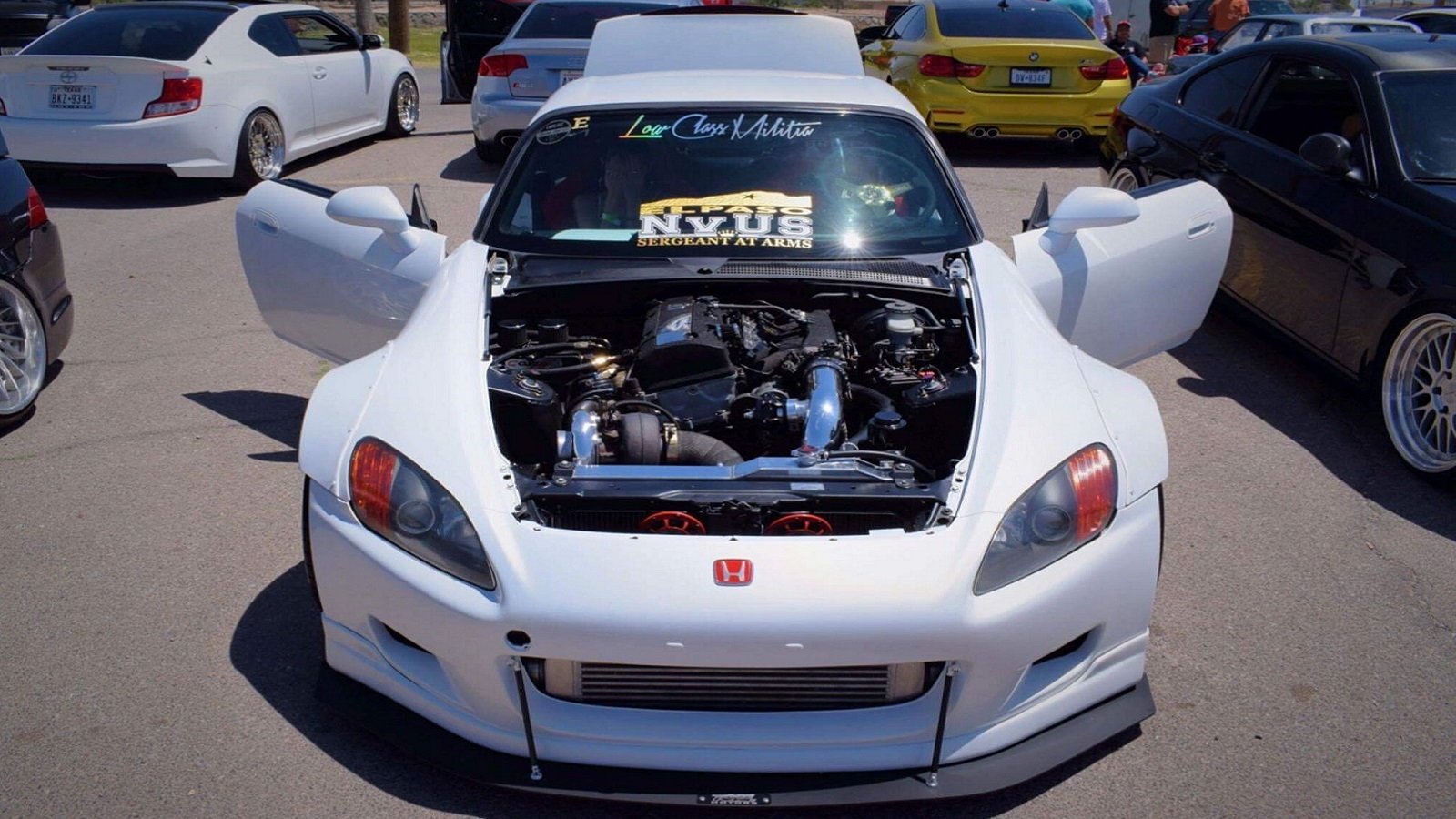 A fastback style Honda S2000 not gonna lie i think it looks amazing  especially in a black and white body with that engine bay stuffed full of  red chrome accents 👌 Fully