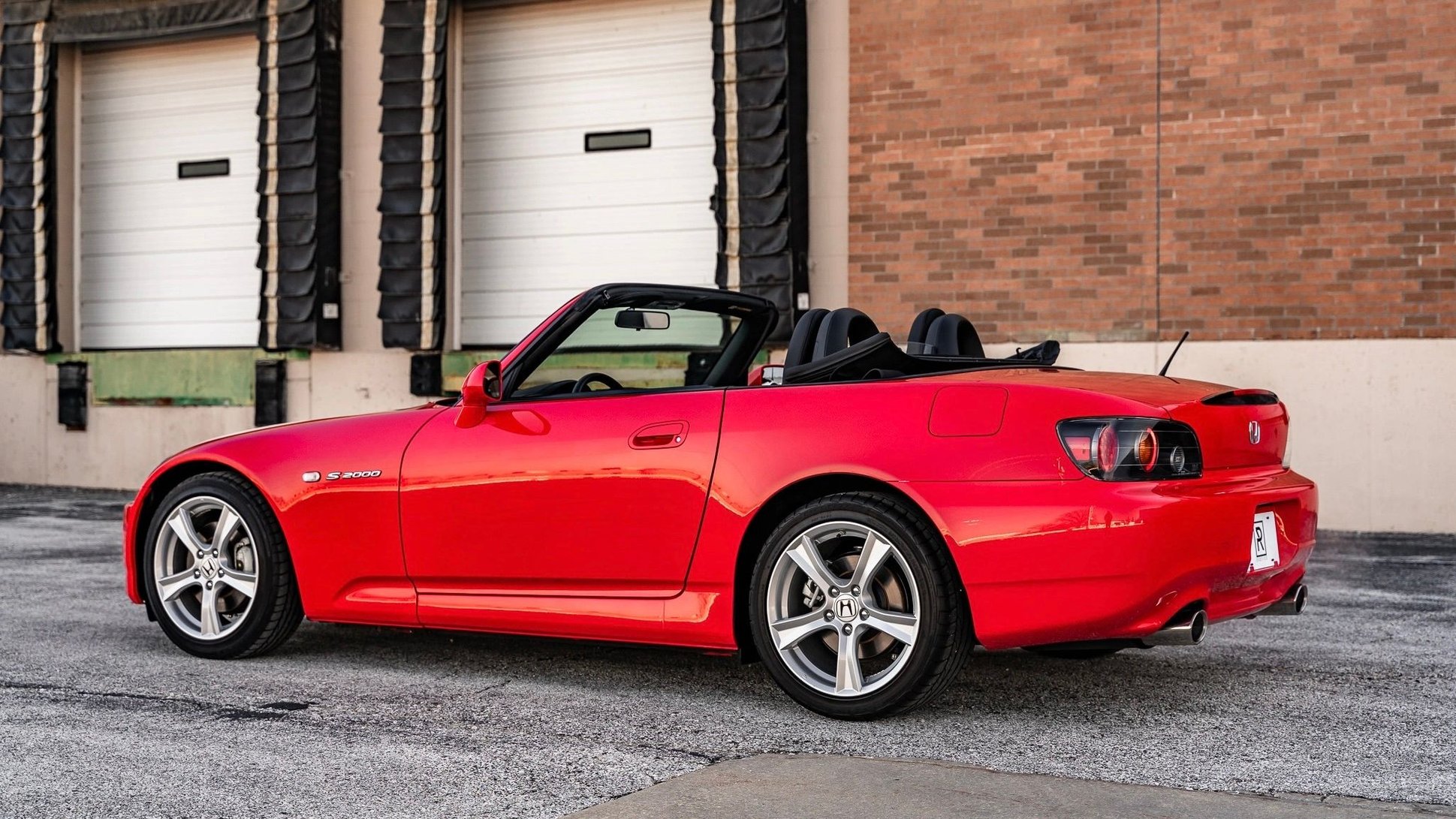 A fastback style Honda S2000 not gonna lie i think it looks amazing  especially in a black and white body with that engine bay stuffed full of  red chrome accents 👌 Fully