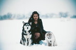 woman between 2 wolves