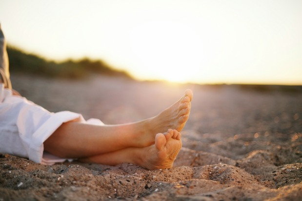 Woman resting on the sand