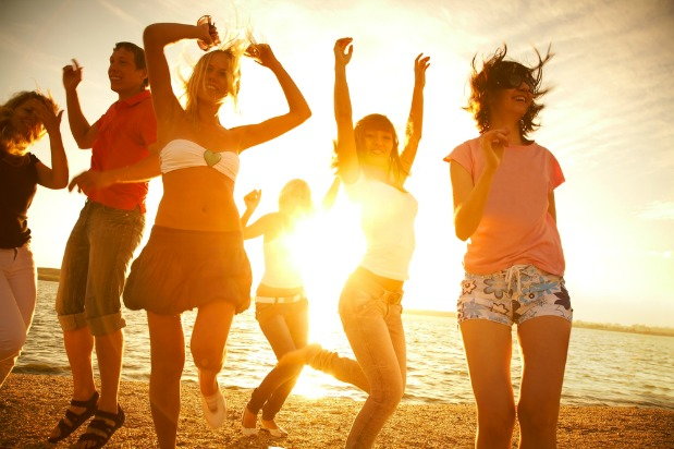 people dancing on a beach