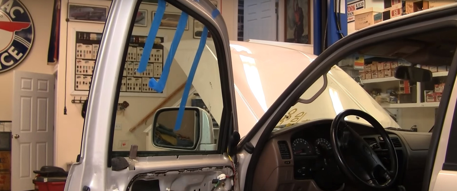Pull the window all the way up and secure it using painter's tape