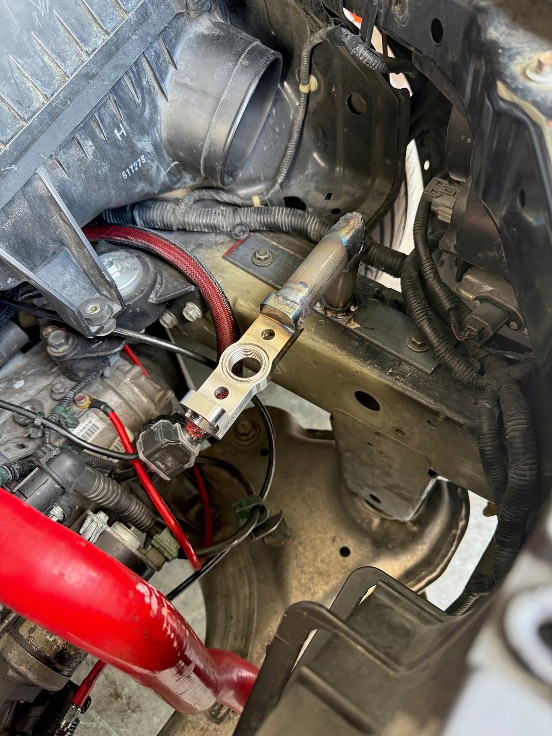 The mount is fully welded up. I still have to fix the two holes I made though.