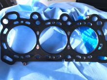 To fix this I used a dremel and cut the steel I coated middle layer of the 3 layer MLS head gasket. Because those water passages are not in the critical raised portion of the head gasket and the modified portion was the middle layer, this was safe to do. I did not lose control of the dremel oven once,  I’m proud of that as the head gasket would be toast if I did.

I only have to deburr the new holes with a jewelers file for my own sanity, and wipe each layer with my new “cleaning rags”.