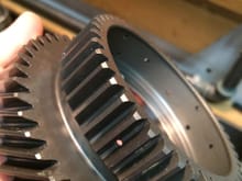 4th gear has residue of 5th gear friction material that settled down into teeth of 4th gear.
