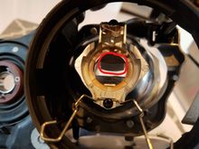 The top is the lower metal bracket/block for the fogs, remove this. The bottom is the cut shield (reverses through the projector lens much like our eyes reverse the image).