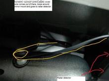 Wire tucks above the headliner, loops around the mirror mount and goes to the radar detector. backwards view