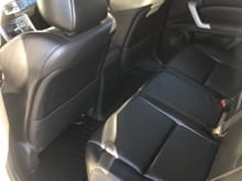 It did not come with the rear WeatherTech floor liner as the previous owner did not have it, so I purchased this after we got home. Again, it hardly looks like anyone has ever sat in the back seats. No complaints here...