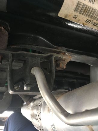 Loose Exhaust hanger bolt by the header down pipe 