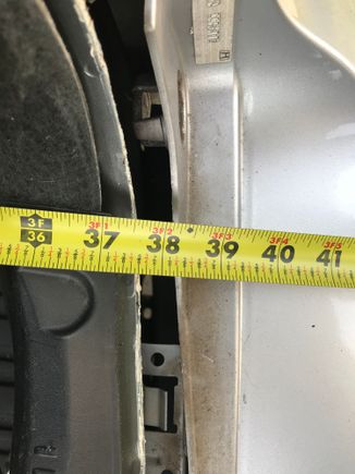 Measuring from the back of the trunk to the rear bumper on the right side of the TL Sport we get 37.50”

That’s .25” of forward movement from the impact on the right side.