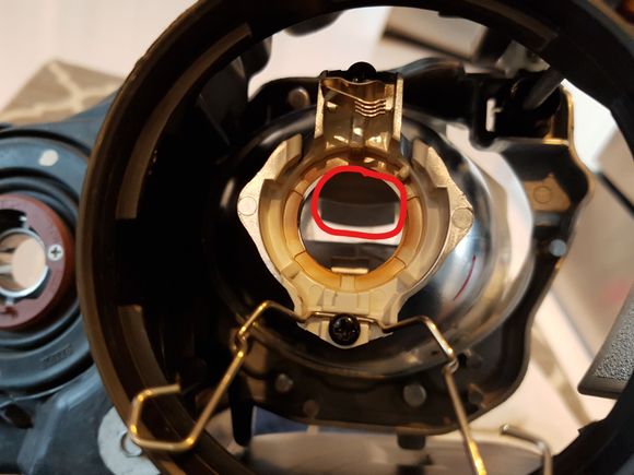The top is the lower metal bracket/block for the fogs, remove this. The bottom is the cut shield (reverses through the projector lens much like our eyes reverse the image).