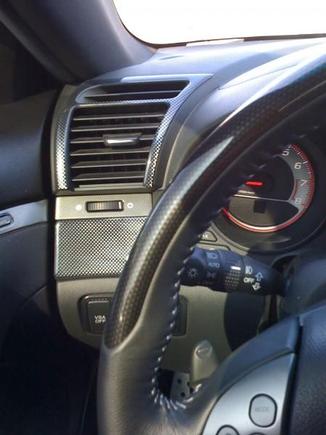 Carbon fiber vents and steering wheel.