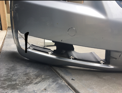 Line is where original grille ended in the bottom and you can see where and how much I had to cut. Cut the back part of the bumper as well, to accommodate a new fog light as well! After cutting just continue with the same process, cutting the slits for the tabs on the lip!