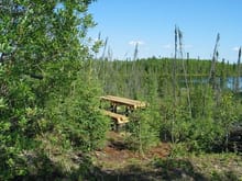 Log Picnic Table overseeing a Small Lake                                                                                                                                                                