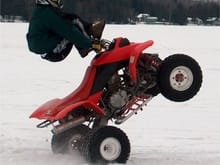 Bar Hop wheelie (Standing to legs over) on the ice.                                                                                                                                                     