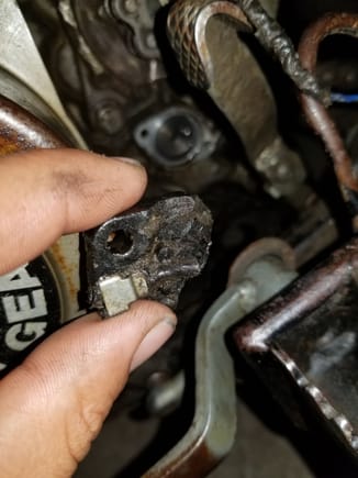 Does anyone know what this plastic part is called it goes right behind were im holding it next to the front sprocket and has a blue wire that goes to it 91 Suzuki lt230e.  