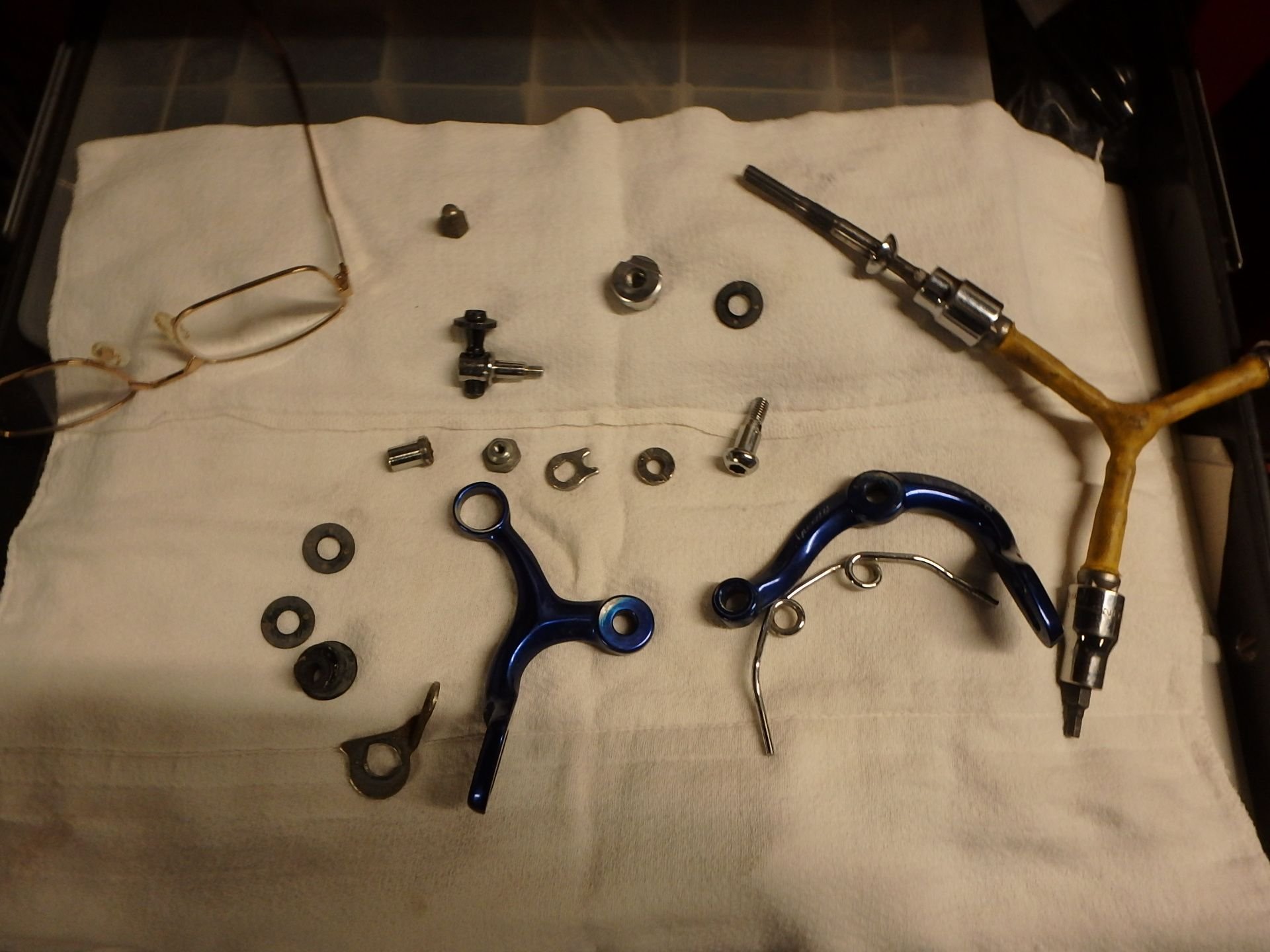 The caliper in pieces after cleaning, a few items were rust damaged or bent.