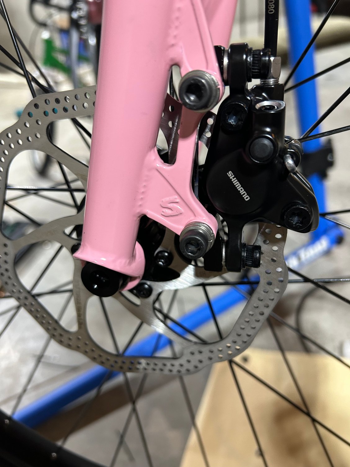 I�ve been mounting brake calipers are they were stuck and not turning. I found the rotor(avid) was running into the caliper. I was able to get the brakes working without rubbing by using 2 lockwashers(5mm) between the brake caliber and the adapter. Is this safe to run any washer on this brake shimano mt200? If that is ok, flat washer would be better right? If that is unsafe what options do I have, change rotor, adapter?