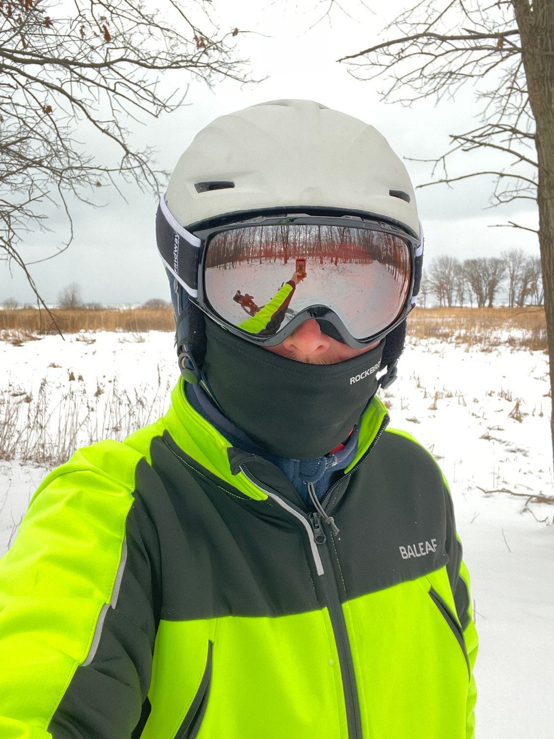 Dressed for the cold. Thick fleece under riding jacket, fleece balaclava, and ski helmet & goggles replace cycling ones.