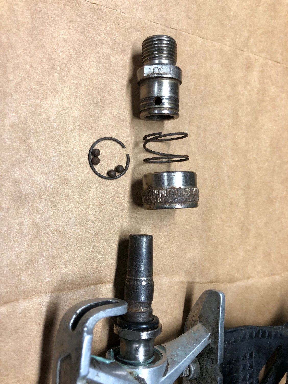 Retract the coupler ring, carefully remove the circlip, and it all comes apart!