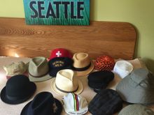 Only one Stetson, next to bowler.  Couple of straw hats.  Only a few cycling ‘hats’.  DEC was a great customer over 2 decades. ‘Mid-watch at sea on the bridge’ ballhat.