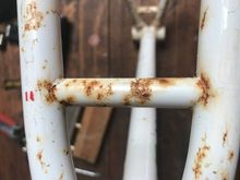 Frame not pretty but no dings nor holes. The rust should clean off with white vinegar and kitchen roll.