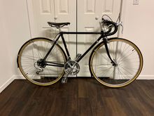 Lugged Light High Tension Steel Tubing. Heavy but perfect for a city commuter/rainy day bike.