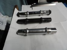 Three spindles, 68 on the bottom 70's on the top.
The original spindle from the complete BB on top with the bolts.       
