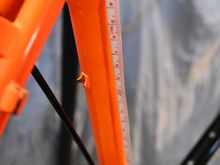 I measured from the center of the seat tube top tube junction.  The housing stop on the seat stay for the for the RD  