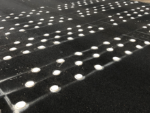 No straight path except on shoulder or along lane line.  The dots are slick.